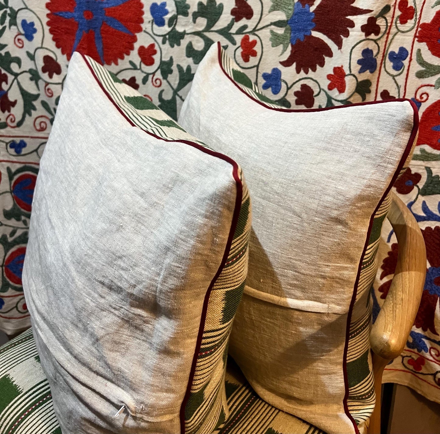 Handmade piped cushions in Christopher Farr Cloth Lost and Found by Kit Kemp