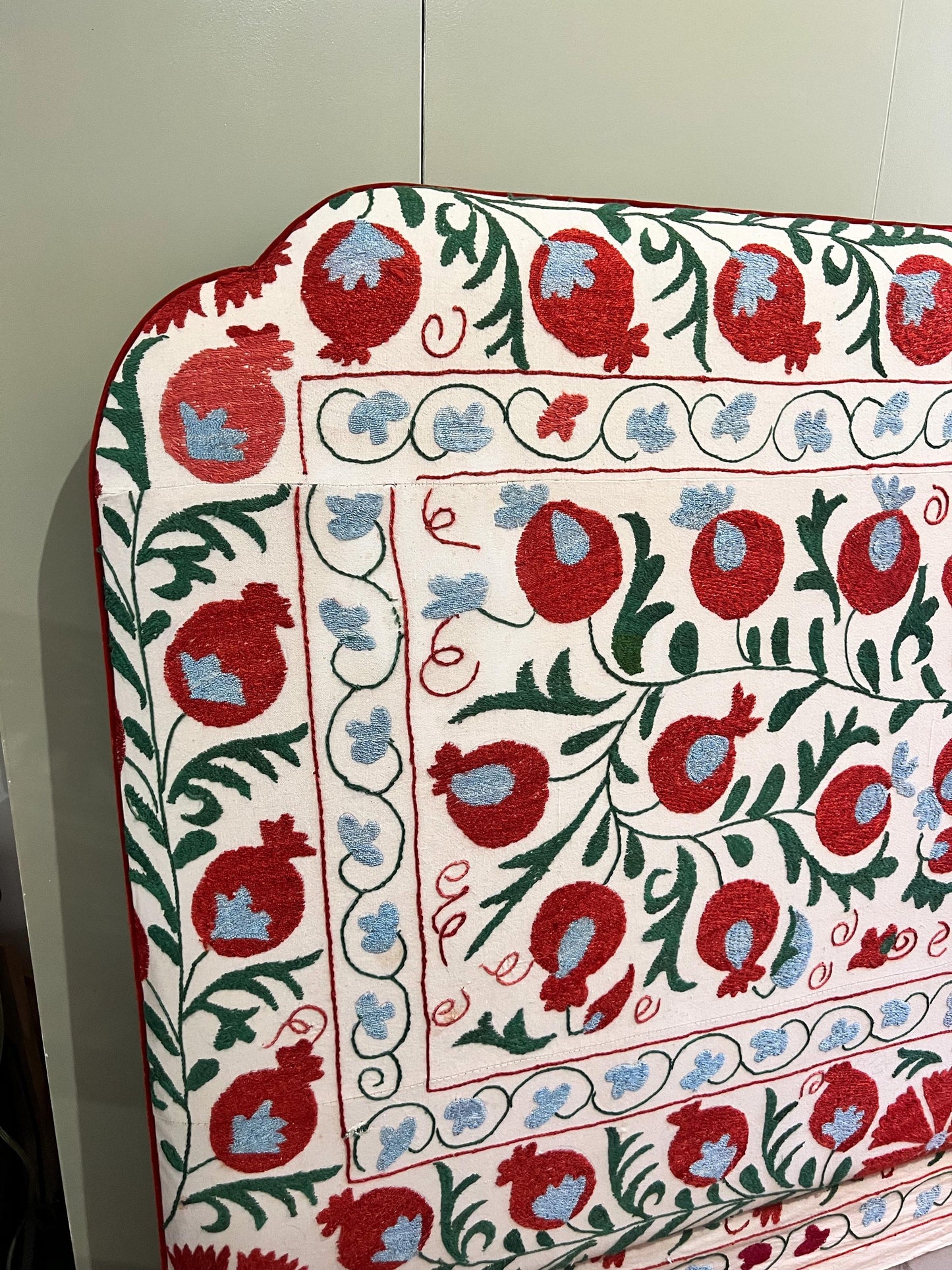 Bespoke luxury silk-embroidered Suzani upholstered headboard made to order