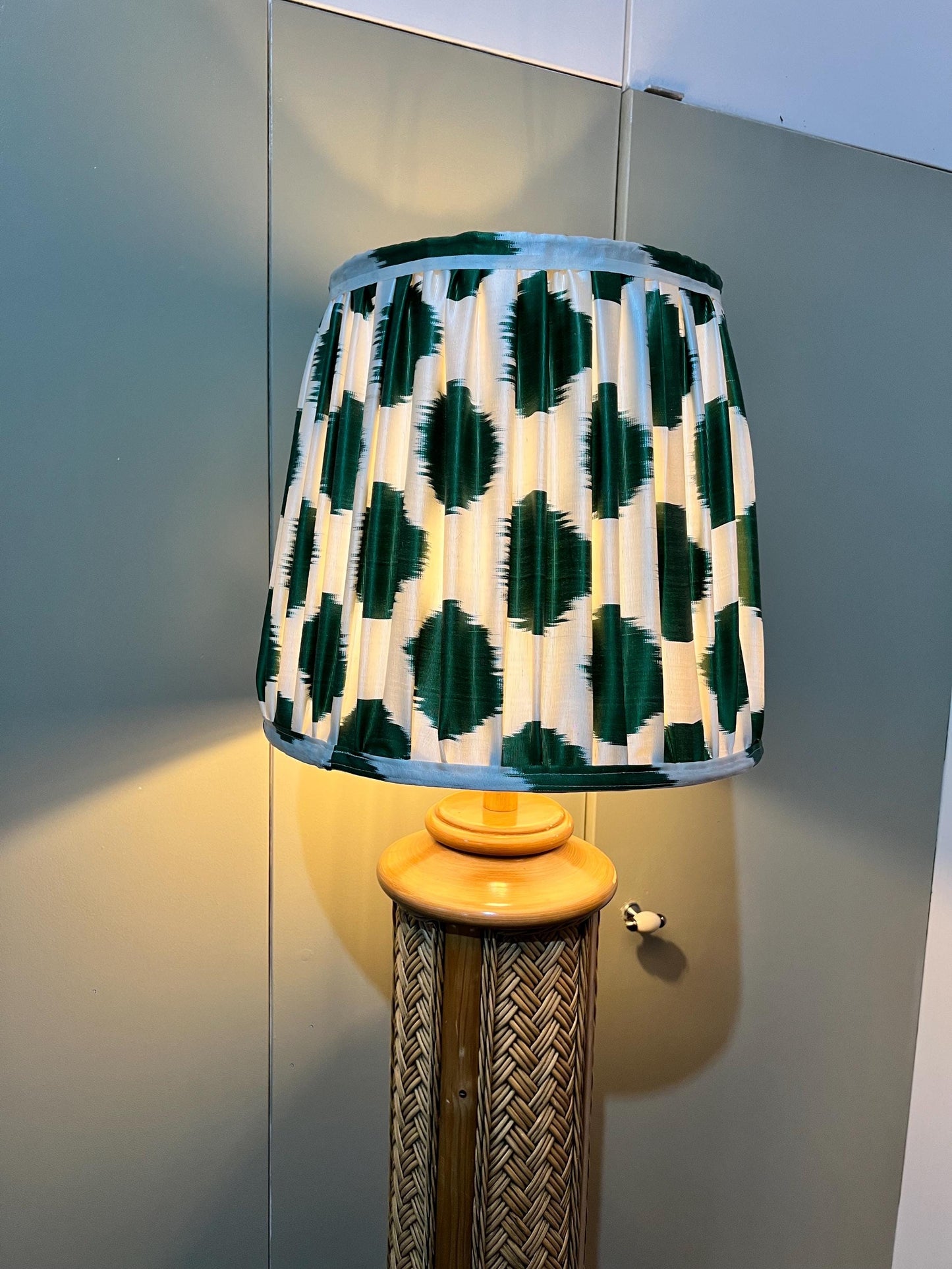 Vintage 1970s woven rattan floor-standing lamp, paired with a handmade blockprinted silk ikat lampshade.