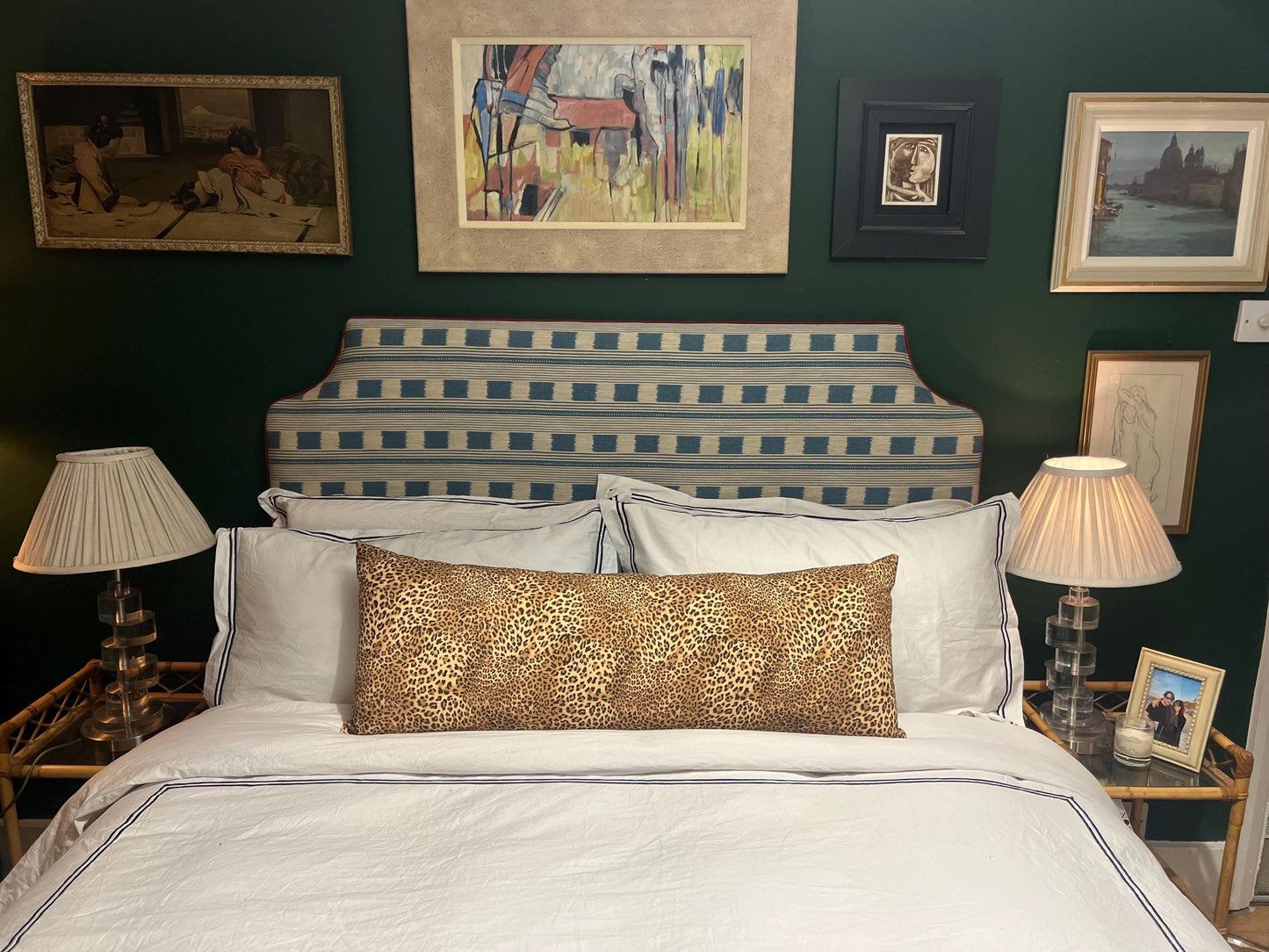 Large leopard print bolster cushions backed with green velvet backing