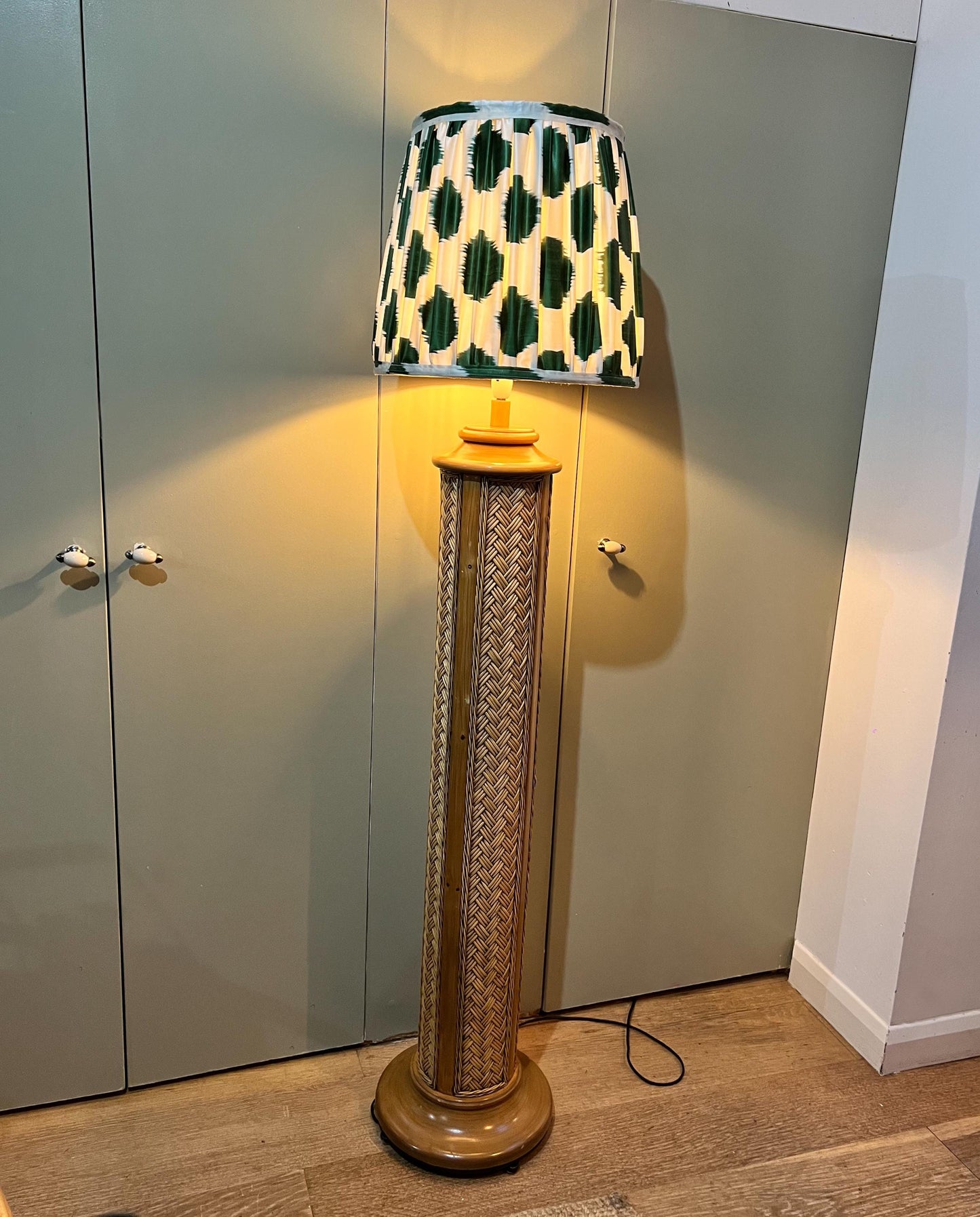 Vintage 1970s woven rattan floor-standing lamp, paired with a handmade blockprinted silk ikat lampshade.