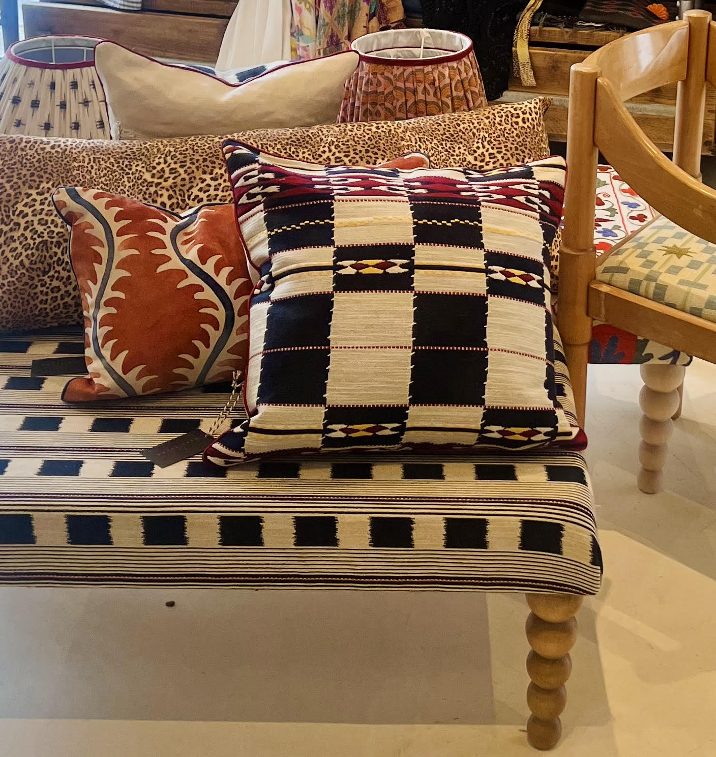 Handmade piped cushions in Christopher Farr Cloth Chubby Check by Kit Kemp