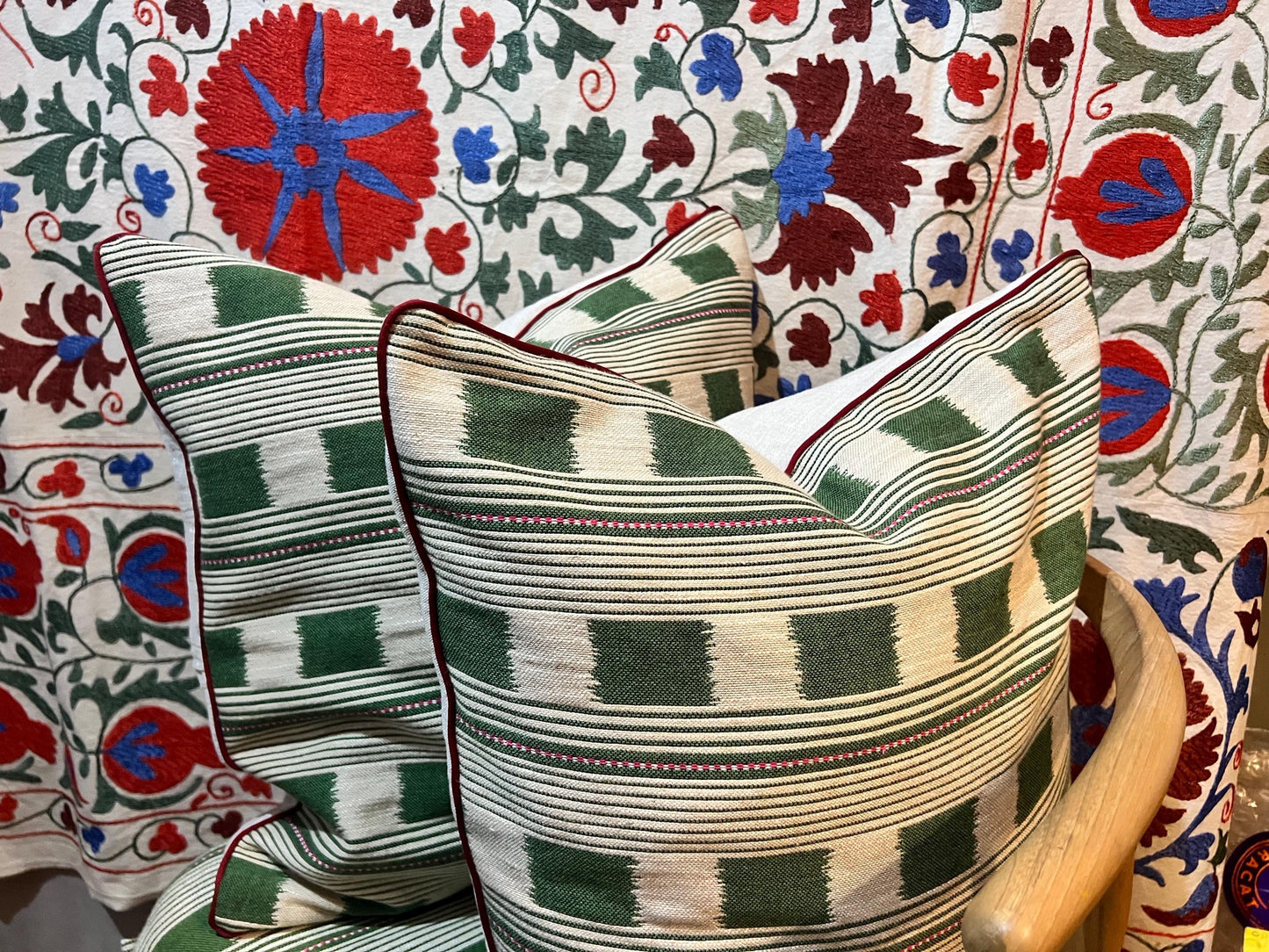 Handmade piped cushions in Christopher Farr Cloth Lost and Found by Kit Kemp